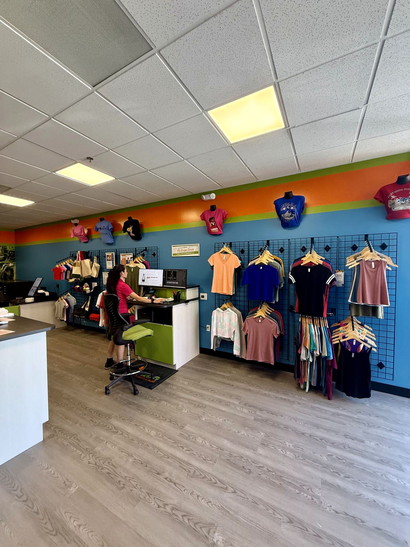 Retail merchandising wall with apparel displays and service counter, Santa Monica store buildout by ASEP Contractors