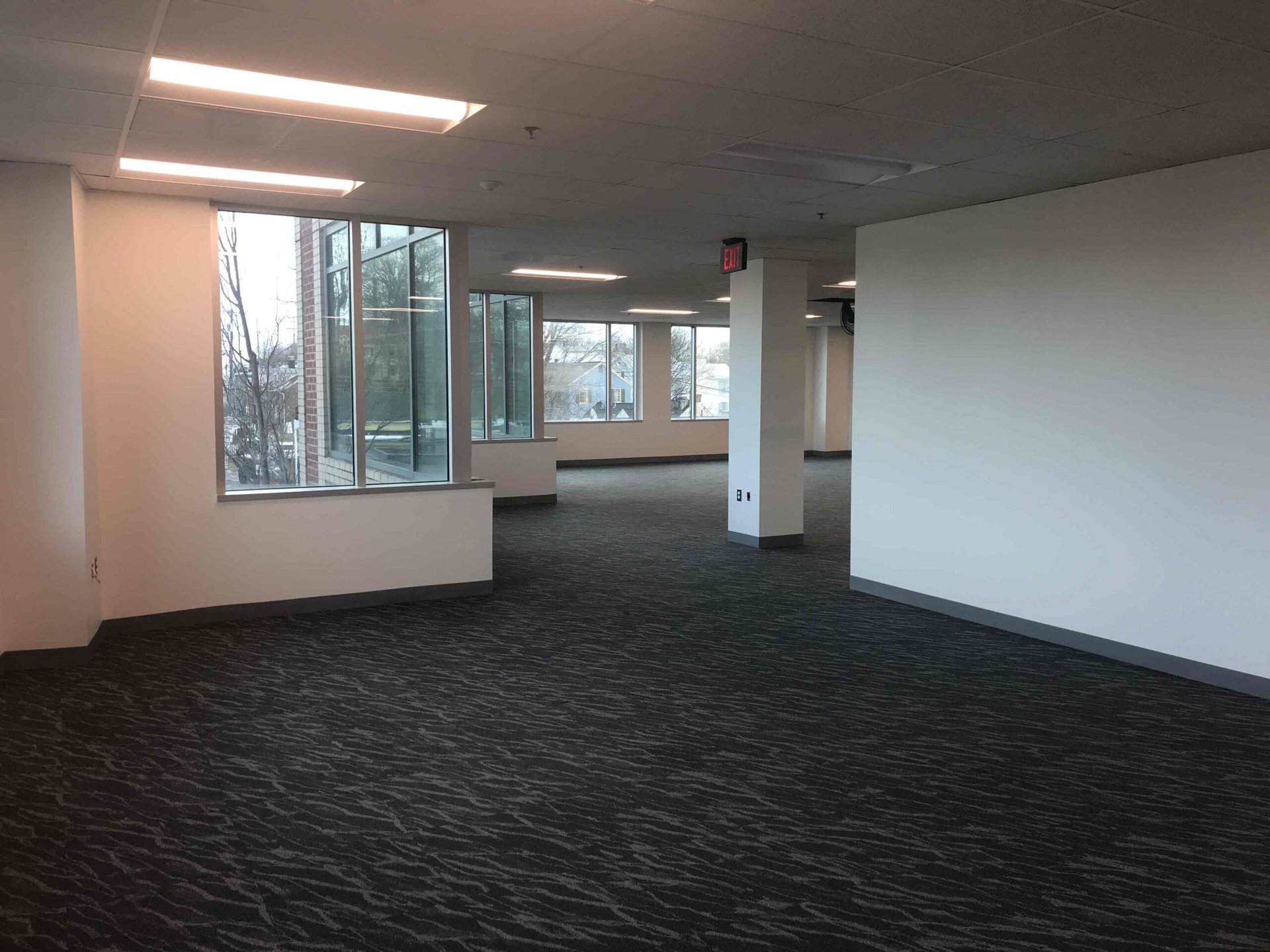 Finished open office floor with new carpet and window line, Loudoun County renovation by ASEP Contractors